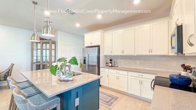 Building Photo - EXCEPTIONAL AND SPACIOUS FURNISHED TOWNHOME WITHIN WATERSIDE- NAUTIQUE!