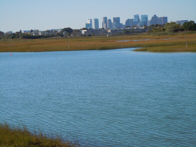 inlet at mid-tide with Boston skyline, looking southwest - 103 Summer St