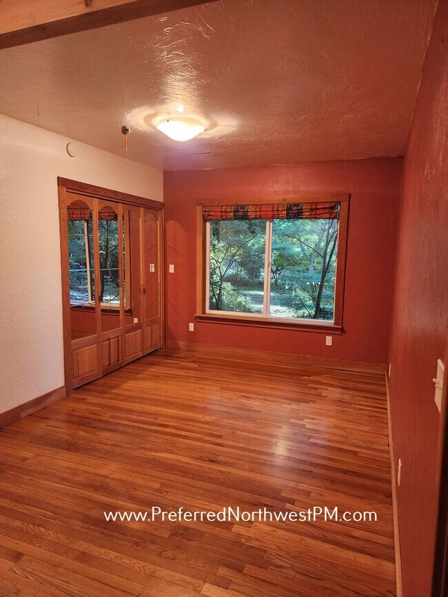 Building Photo - Beautiful home on 2 organically-landscape ...