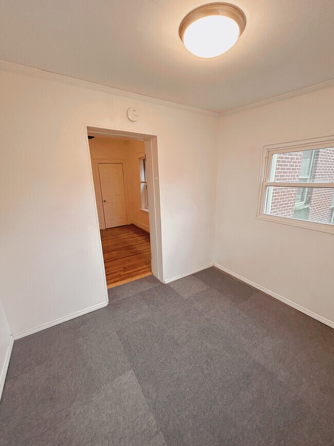 Bright sunroom overlooks the spacious back yard - 2705 S Kingshighway Blvd