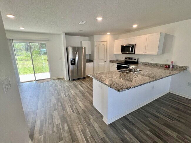 Primary Photo - Spacious 4-Bedroom Home with Primary Suite...