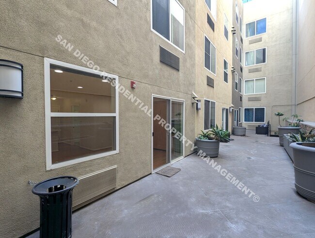 Building Photo - Updated Studio with Parking and Washer/Dryer in Prime Little Italy Location