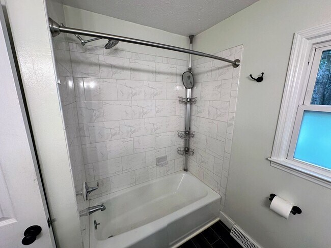 Building Photo - AVAILABLE NOW! Spacious 4 BR, 2 Bath House! Wood Floors, Attached Garage, W/D Included