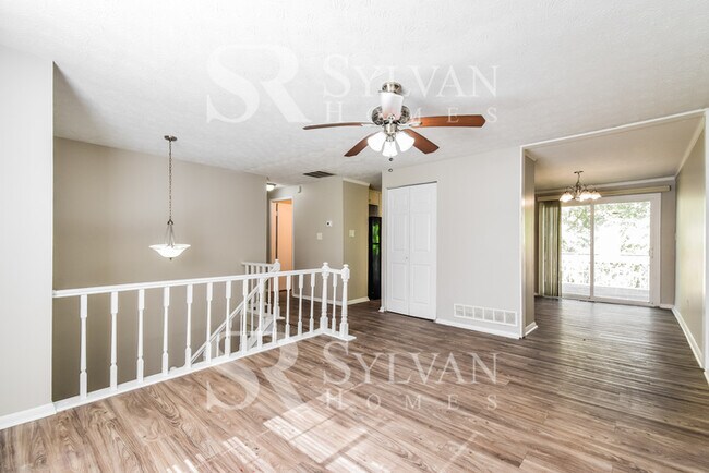 Building Photo - The living is easy in this 4 bedroom, 2 ba...