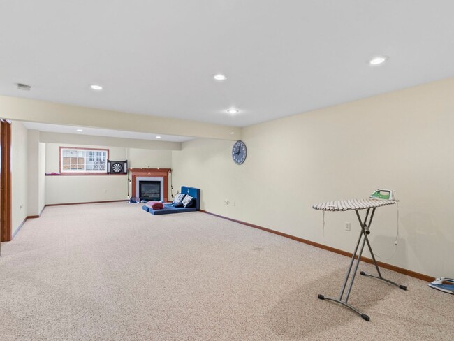 Building Photo - Spacious 3BR/3BA Condo with Finished Basement + 2-Car Garage — Available Now