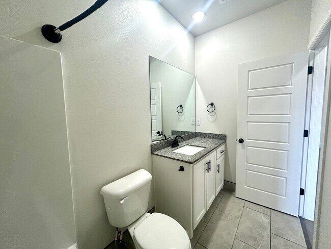 Building Photo - Centerton Home Available NOW! 4 bed, 2 full bath no carpet home. LARGE fenced backyard