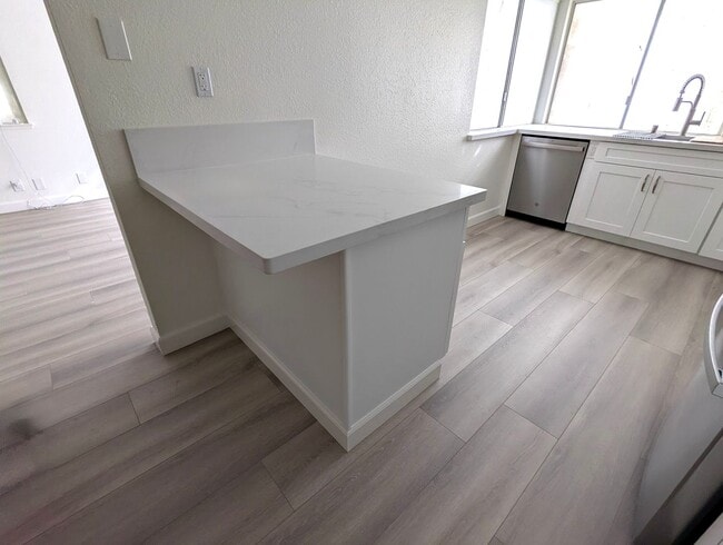 Building Photo - Total remodel - New kitchen, new bathroom, new appliances, new electrical, new paint, new floors