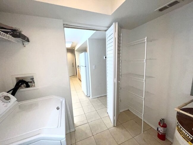 Building Photo - Move in NOW- Spacious 2 bedroom 1 bath condo on 3rd floor in gated community! Water included with...