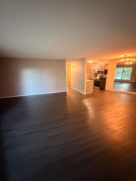 Livingroom, hallway, kitchen and mirrored dining room wall. - 8935 Old Cedar Ave S