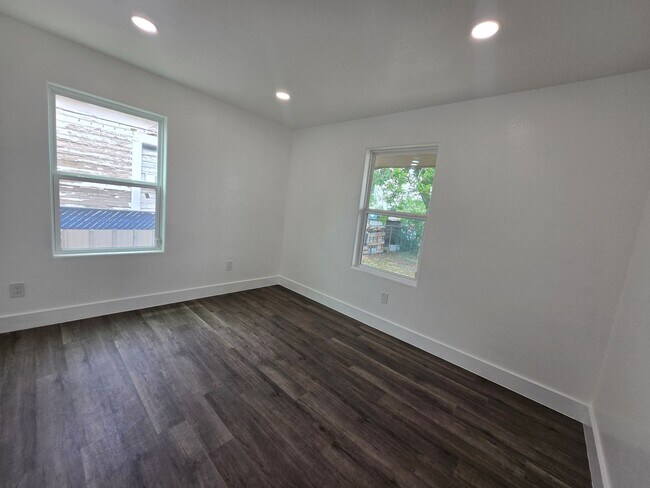Building Photo - New paint and flooring throughout.