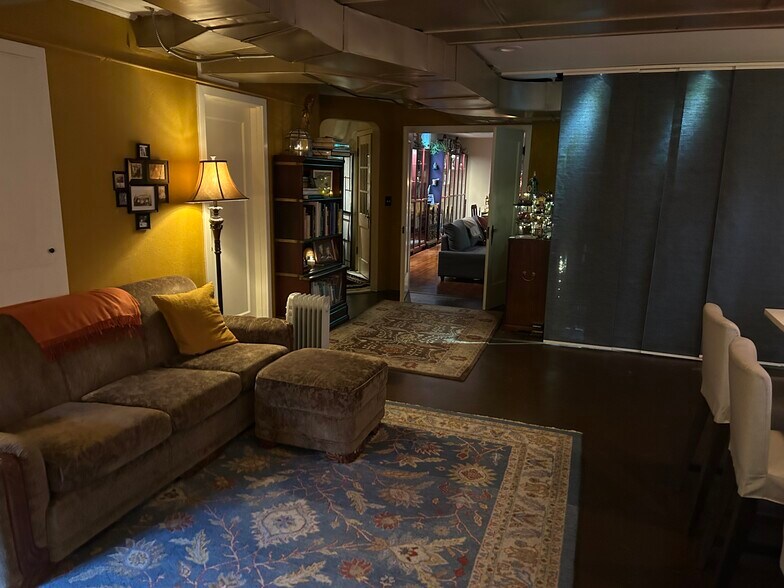 Lower level living space with seating area - 3846 NE Maywood Pl