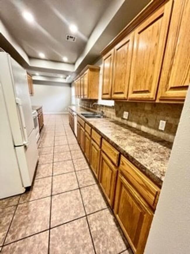 Building Photo - Spacious 3-Bed, 2.5-Bath Fourplex with Gar...