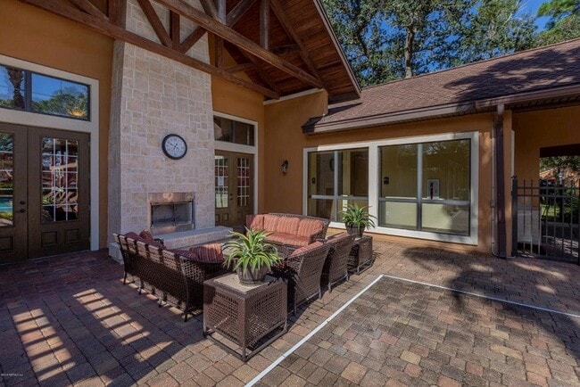 When nights get cool, enjoy the outdoor fireplace. - 100 Fairway Park Blvd