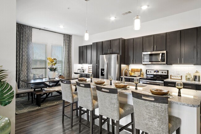 Expansive kitchen islands with ample counter space - Windsor Lakeyard District