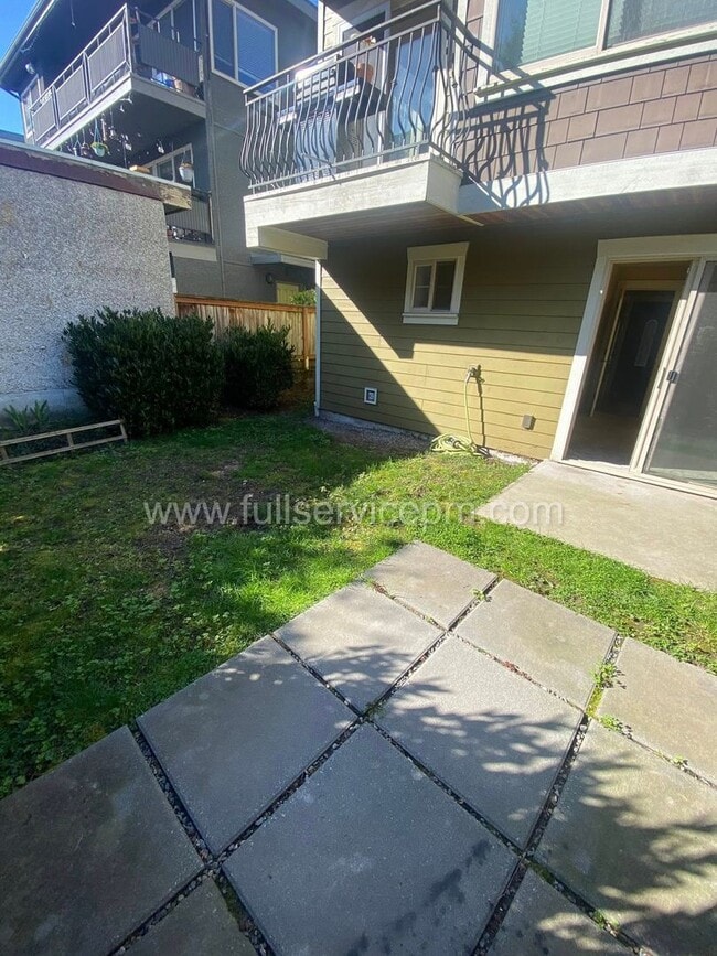 Building Photo - Spacious townhome with private backyard, garage parking, multiple decks, and a dedicated home off...