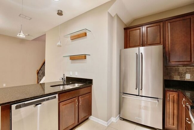 Building Photo - Gorgeous 4/2.5 Spacious Townhome with a Loft Area and a 2 Car Garage in the Desirable Gated Commu...