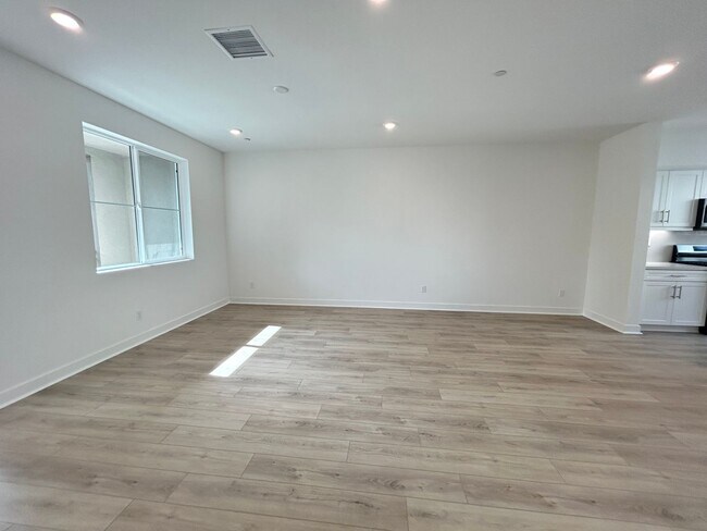Building Photo - Gorgeous, 3 level townhome, featuring 2 car garage central Air, and in Unit laundry.