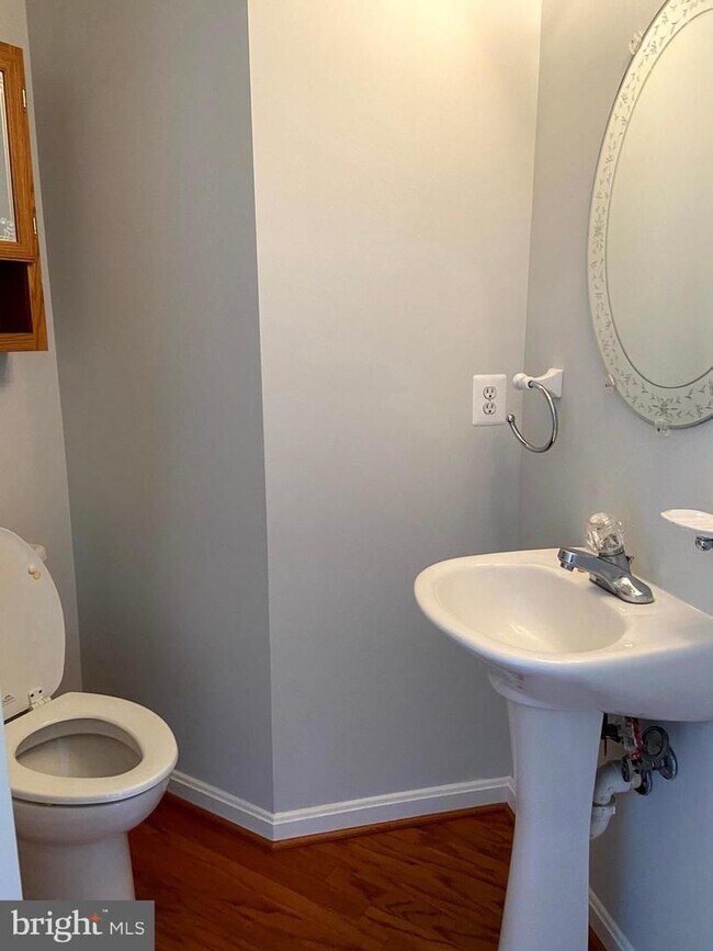 Building Photo - Welcome to this beautifully appointed two level upper condominium that combines modern style with...
