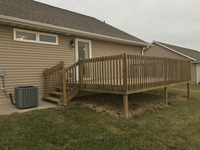 Large deck in back overlooks field. - 113 Scenic Dr