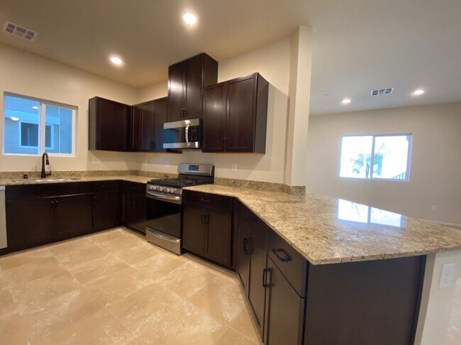 Building Photo - 4 BED 3 BATH Townhome, 1 LOFT, 2 GARAGES, GATED!