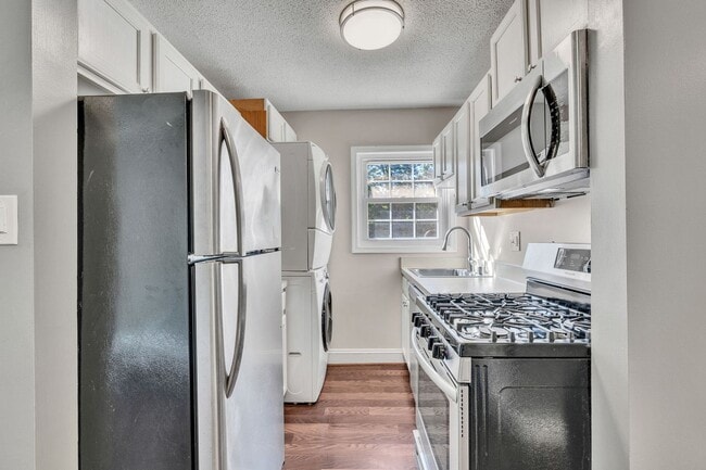 Building Photo - Utilities Included! Updated 2-Bedroom Condo Just Steps from Huntington Metro