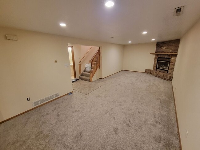 Building Photo - 4 BD, 2 BA - FENCED IN YARD, PRIVATE TRAILS, FINISHED UPPER AND LOWER LIVING AREAS, ATTACHED GARAGE!