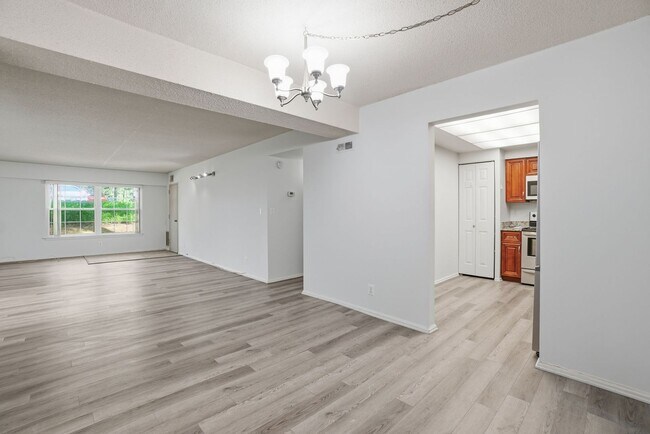 Building Photo - This expansive ground level residence is set within a serene, gated garden community surrounded b...