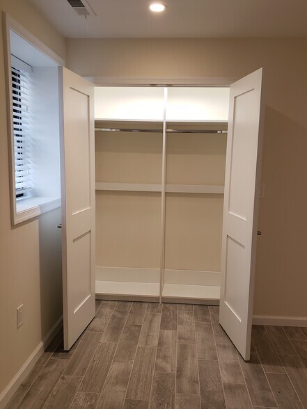 Bedroom #1 | Hanging System + Shelving Installed - 1892 Ontario Pl NW