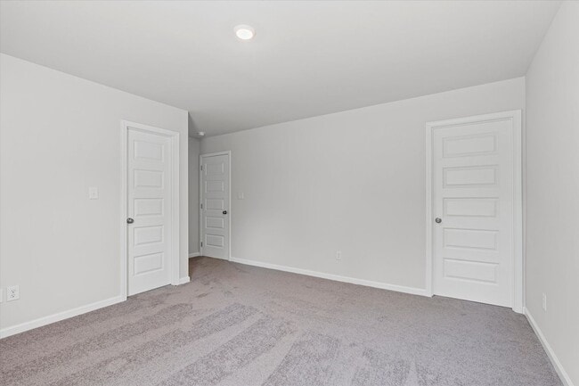 Building Photo - New 3BR Home in Whispering Woods – Modern ...