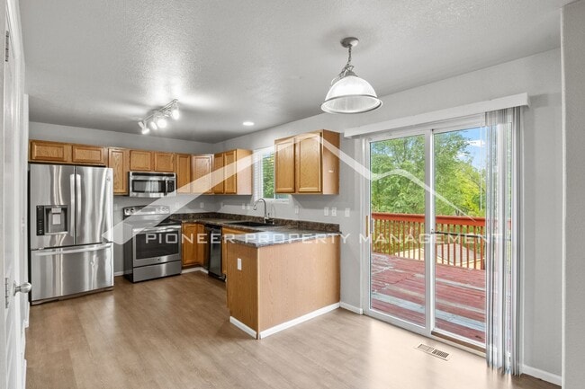 Building Photo - Spacious 4-Bed, 3.5-Bath Home with Walkout Basement, Oversized Deck enclosed yard, AC and 2-Car G...