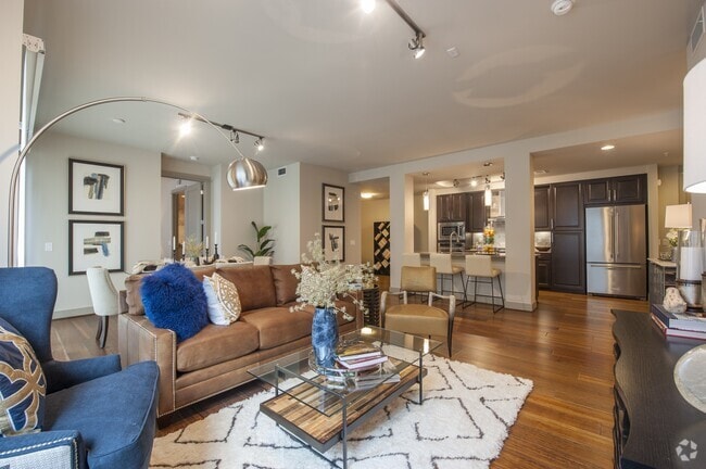 Seamless flow between the cozy living space and modern kitchen - Pearl Residences