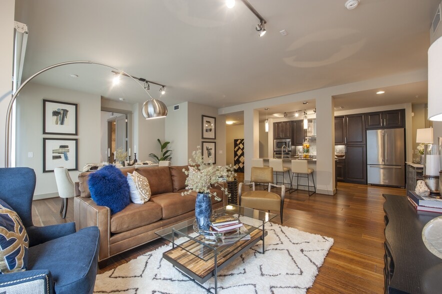 Seamless flow between the cozy living space and modern kitchen - Pearl Residences