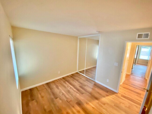 Building Photo - Remodeled 4 bedroom with central A/C and 2 car garage!