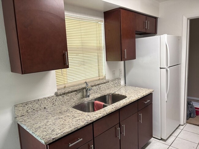 Building Photo - Spacious home on shaded lot off the main path