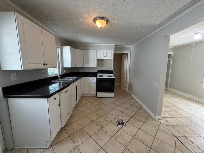 Building Photo - Charming West Side Home with Covered Porch & First-Floor Laundry