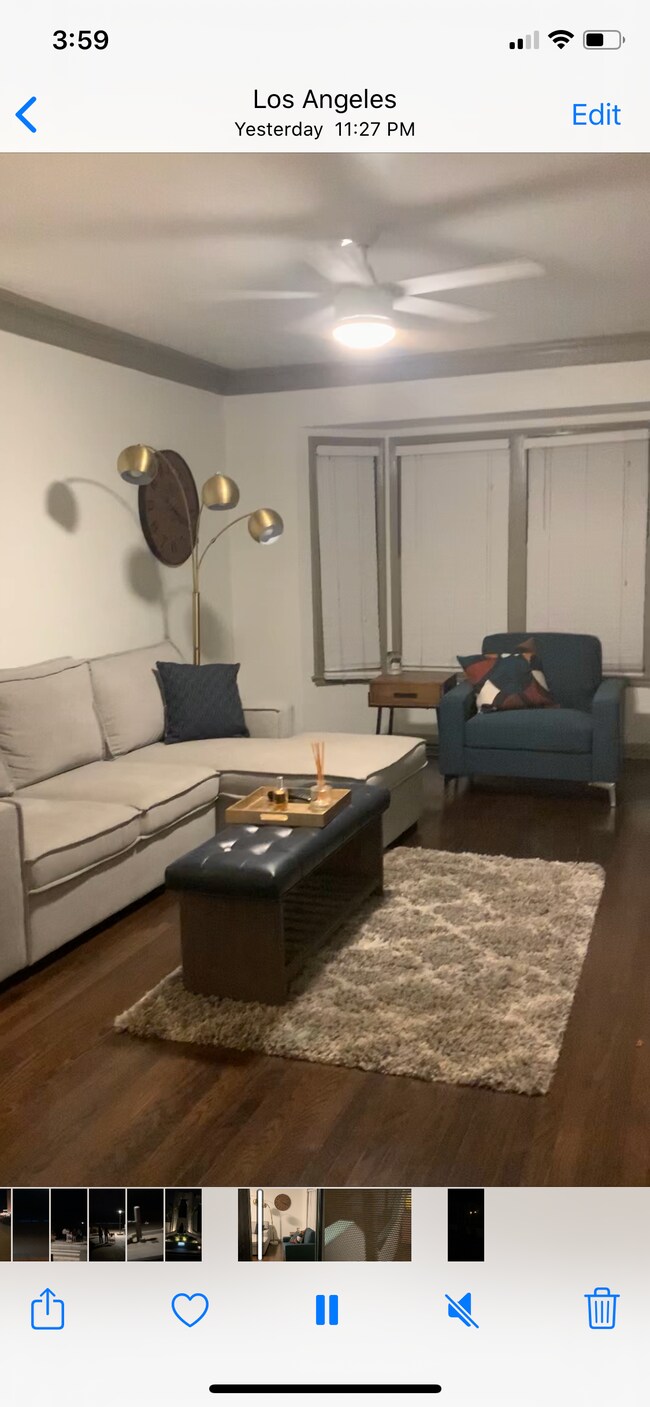 Living room couch opens up to a sleeper - 3622 W Adams Blvd