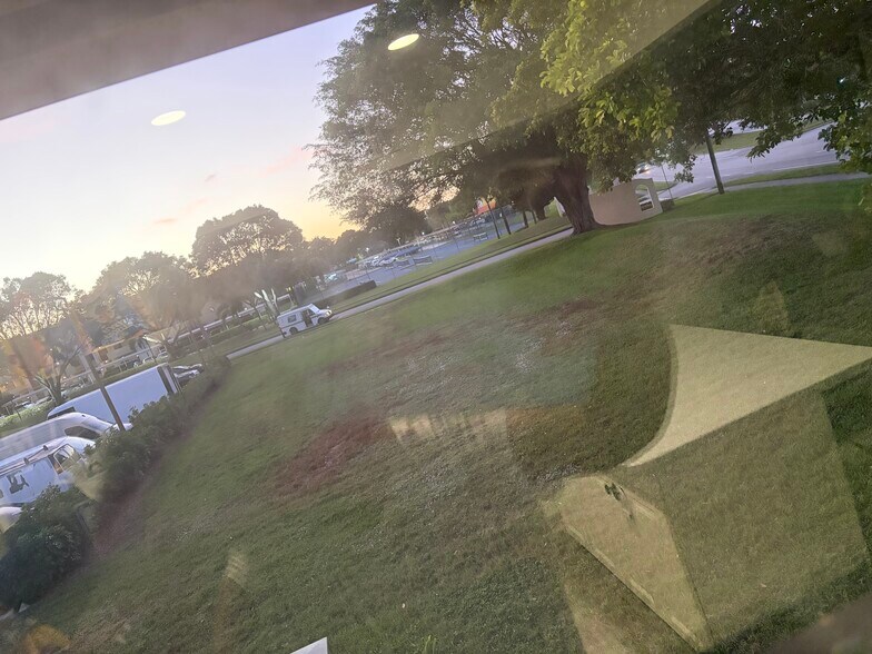 This corner is a corner unit has a very big patch of grass in front of the apartment - 9521 Boca Cove Cir