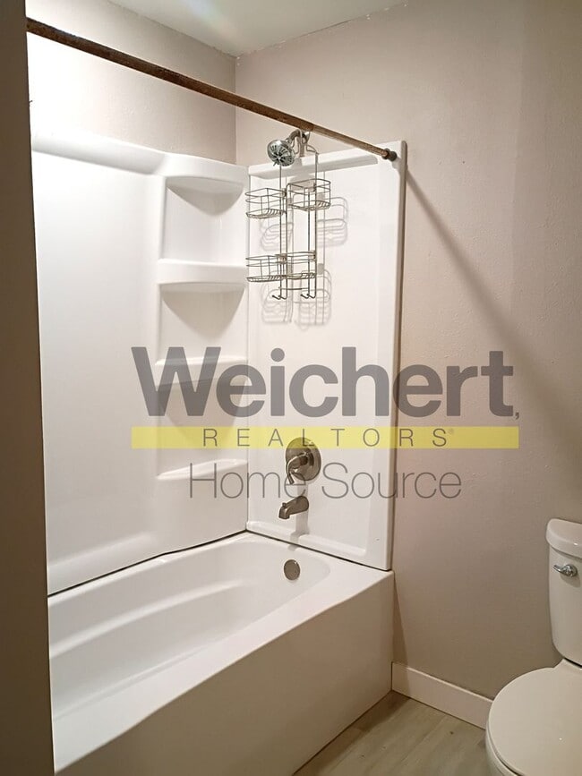 Building Photo - Updated 4-Bed Home with Fenced Yard & Carport