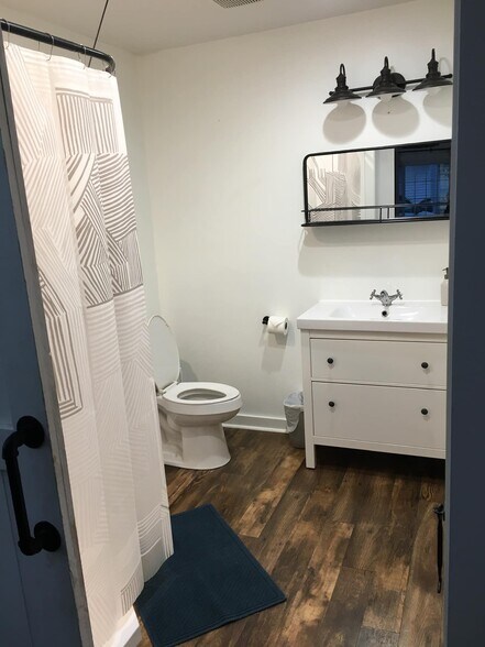 Full bathroom with large closet and washer/dryer - 510 Auburndale Ave