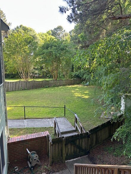 Side yard and entrance to rental - 8 Elam Ct