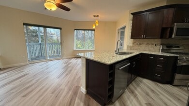 Building Photo - Major Updates! Raised Ranch Style Condo wi...