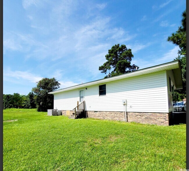 Building Photo - 6003 Sunrise Dr