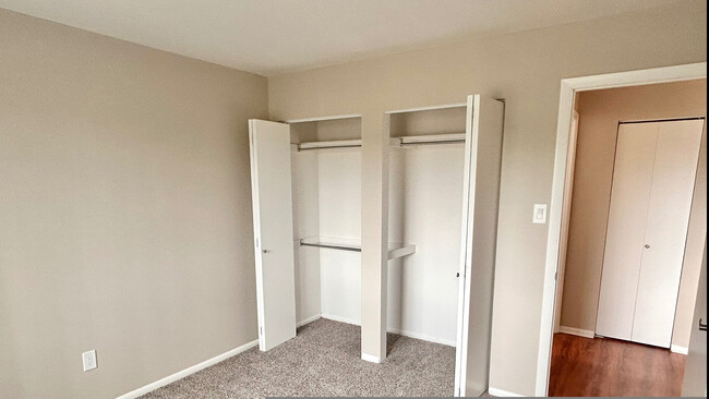 Embrace comfort in this versatile bedroom with ample closet space and a modern finish. - One Park View