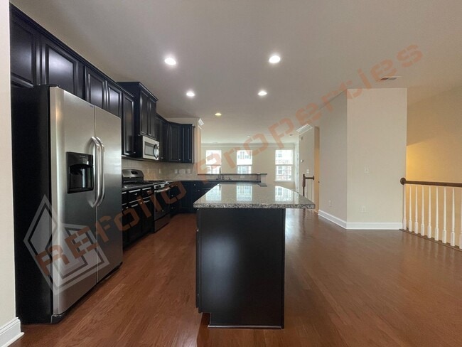 Building Photo - Beautiful 3 Story 3 Bedroom Townhouse with Huge 1st Floor Flex Space with Access to Patio + 2 Car...