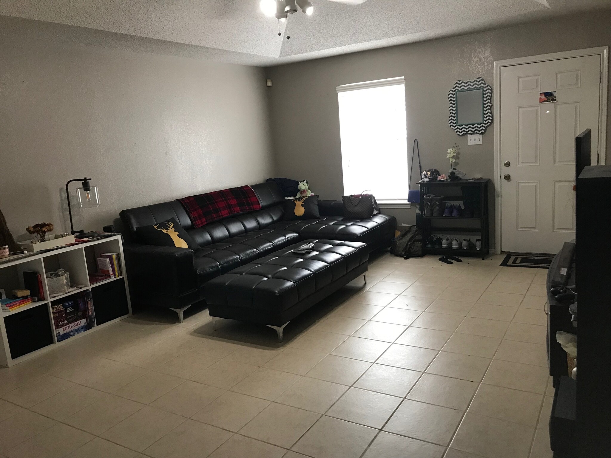 Large living room with ceiling fan and recessed ceiling. - 1801 Lexington Circle