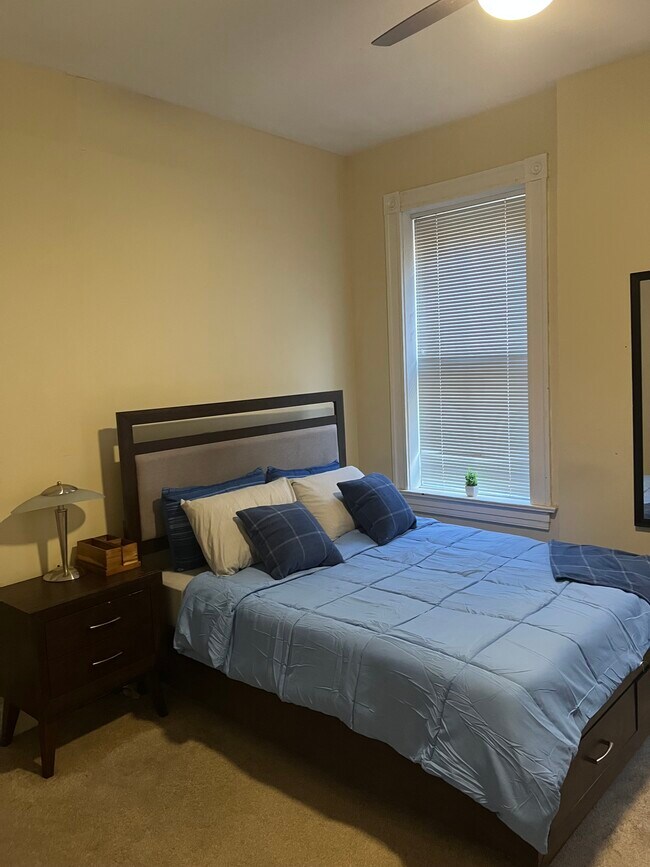Primary Bedroom - Queen Sized Bed; 55-inch 4K Ultra Smart TV; Max Trainer 7 - 2219 Missouri Ave