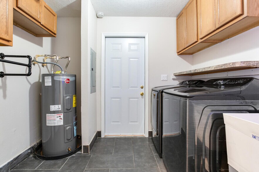 Laundry room with storage and utility sink - 2120 W Spruce St