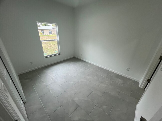 Building Photo - BRAND NEW ONE BEDROOM, ONE BATH-ONE CAR GARAGE- LEHIGH ACRES
