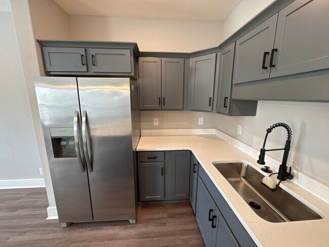 Building Photo - “Stylish 3BR End-Unit | Open Concept | Quartz Kitchen | Garage + Deck