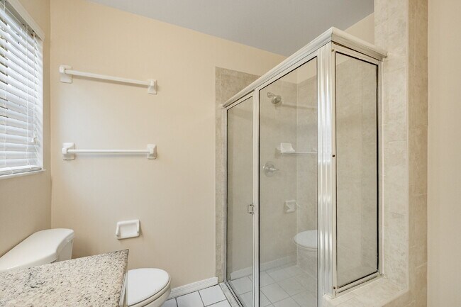 Building Photo - Spacious 3/2 with split plan and large fenced yard!